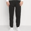 Budget 🤩 Mennace ESSENTIAL REGULAR JOGGER UNISEX - Jogginghose - Black 🤩