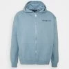 Coupon ✨ Mennace ESSENTIAL REGULAR ZIP UP HOODIE UNISEX - Sweatjacke - Sky Blue ⭐